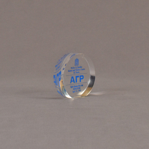 Angle view of 3" circle acrylic embedment with blue image