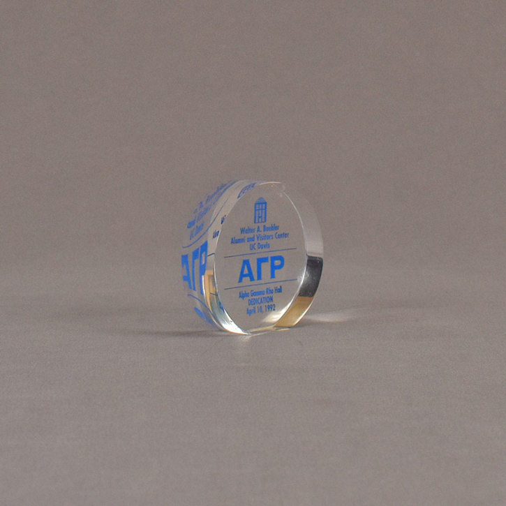 Angle view of 3" circle acrylic embedment with blue image