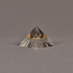 Angle view of 3" x 3" pyramid acrylic embedment award with brass model of airplane cast inside.