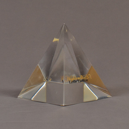 Angle view of 5" x 6" pyramid acrylic embedment award with Highland Little Theatre text cast inside.
