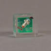 Front view of 3" cube acrylic embedment award with electronic component cast into crystal clear acrylic.
