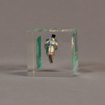 side view of 3" cube acrylic embedment award with electronic component cast into crystal clear acrylic.