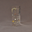 Side view of 5 1/2" square acrylic embedment award with nuts and bolts cast into crystal clear acrylic.