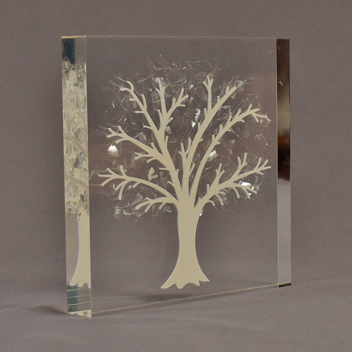 Angle view of 7" square acrylic embedment award with Tree of Life cast into crystal clear acrylic.