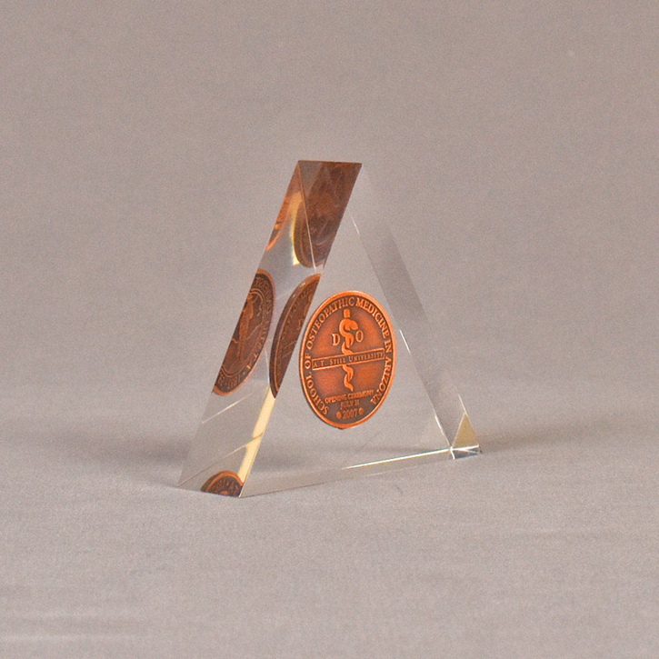 Angle view of 4" triangle acrylic embedment award with copper coin mounted in clear acrylic.