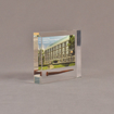 Angle view of 4" x 4 1/2" rectangle acrylic embedment award with rusty nail and building photo cast into acrylic.