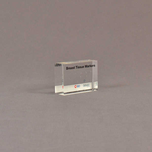Angle view of 2" x 3" rectangle acrylic embedment award with medical tissue markers cast in acrylic.