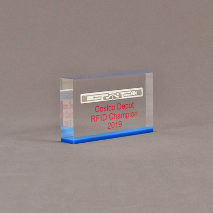 Angle view of 3" x 5" rectangle acrylic embedment award with Costco Depot RFID Champion logo cast in acrylic.