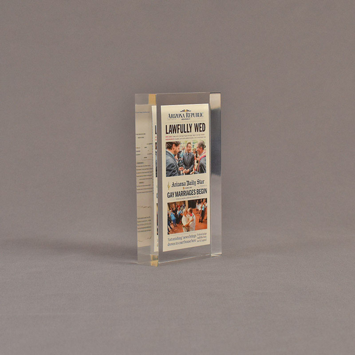 Angle view of 3" x 6" rectangle acrylic embedment award with lawfully wed Arizona Republic newspaper cast in acrylic.