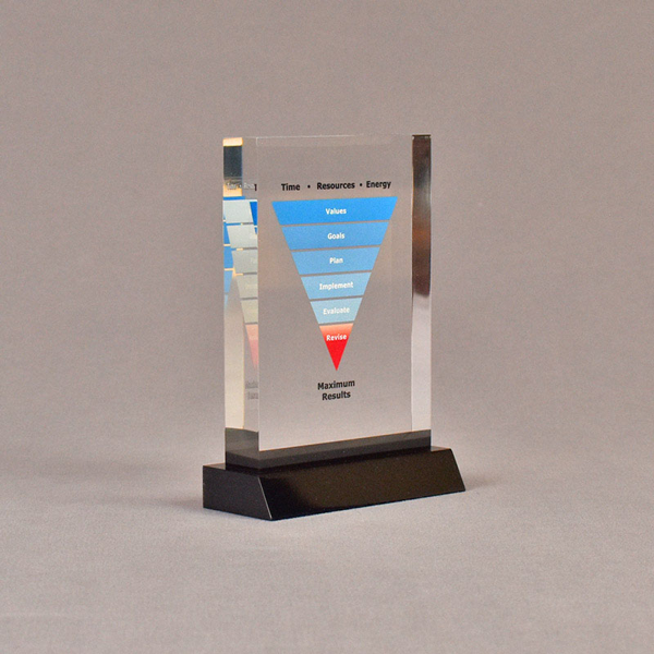 Angle view of 3 1/2" x 5" rectangle acrylic embedment award with maximum results graph cast into acrylic.