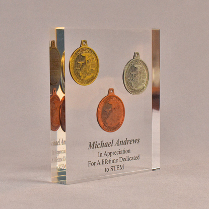 Angle view of 6" x 7" rectangle acrylic embedment award with three Future City coins cast into crystal clear acrylic.
