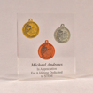 Front view of 6" x 7" rectangle acrylic embedment award with three Future City coins cast into crystal clear acrylic.