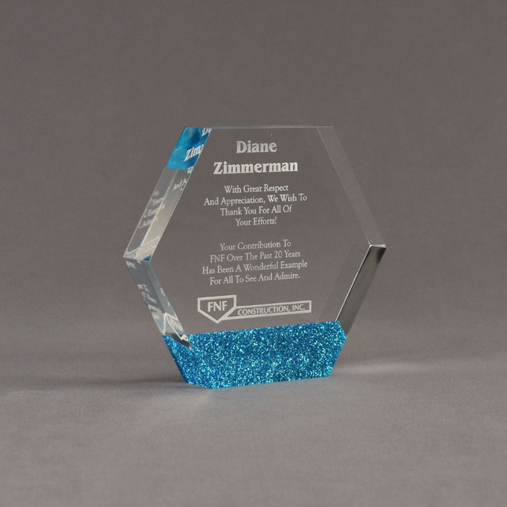 Angle view of ColorCast™ 5" Hexagon Acrylic Award with blue glitter color highlight showing trophy laser engraving.