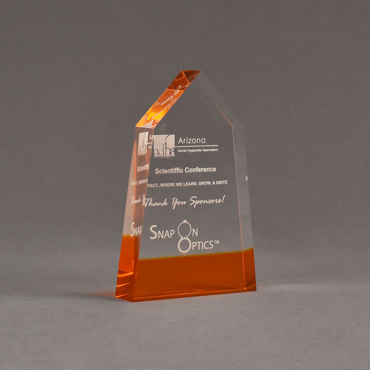 Angle view of ColorCast™ 6" Obelisk Acrylic Award with transparent orange color highlight showing trophy laser engraving.