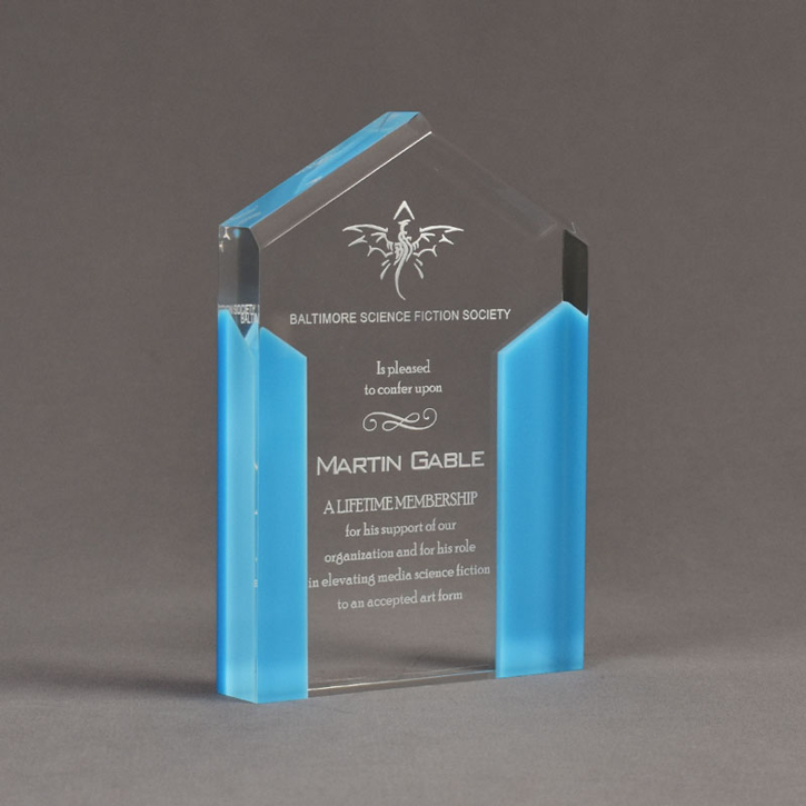 Angle view of ColorCast™ 7" Pillars Acrylic Award with light blue color highlight showing trophy laser engraving.
