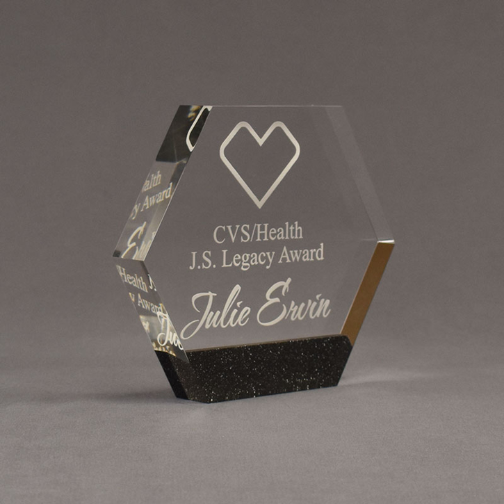 Angle view of Composites™ 6" Hexagon Acrylic Award with Sanded Black Onyx Staron® accent showing trophy laser engraving.