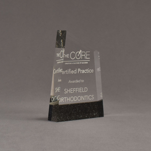 Angle view of Composites™ 6" Meridian Acrylic Award with Sanded Black Onyx Staron® accent showing trophy laser engraving.