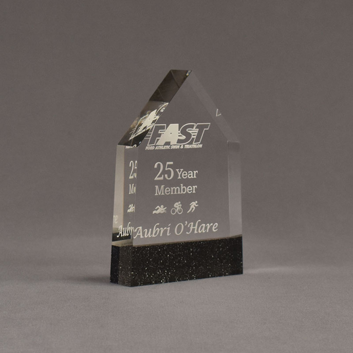 Angle view of Composites™ 6" Obelisk Acrylic Award with Sanded Black Onyx Staron® accent showing trophy laser engraving.