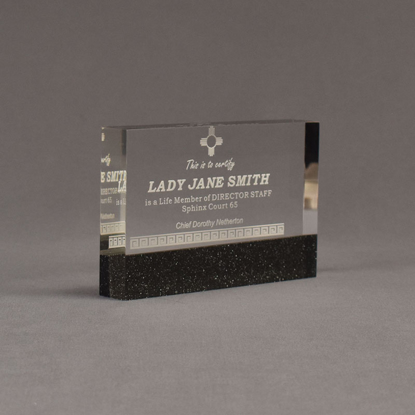 Angle view of Composites™ 6" Rectangle Acrylic Award with Sanded Black Onyx Staron® accent showing trophy laser engraving.