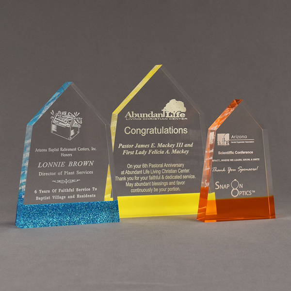 Three ColorCast™ Obelisk Acrylic Awards grouped showing blue glitter, yellow and orange transparent accent color options.