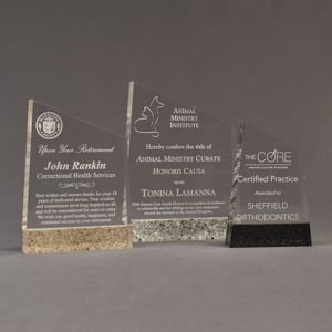 Three Composites™ Meridian Acrylic Awards grouped showing Staron® Aspen Brown, Platinum Grey and Sanded Black Onyx accent options.