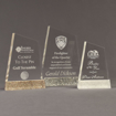 Three Composites™ Apex Acrylic Awards grouped showing Staron® Aspen Brown, Platinum Grey and Sanded White Pepper accent options.