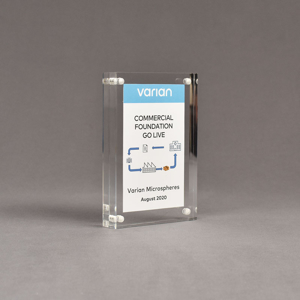Angle view of Allure™ 4" x 6" Acrylic Entrapment Award with printed Varian message inside two pieces of clear acrylic.
