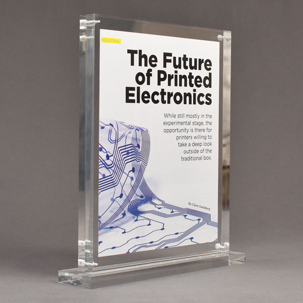 Angle view of Allure™ 8" x 10" Acrylic Entrapment Award with printed Future of Printed Electronics message inside two pieces of clear acrylic on base.