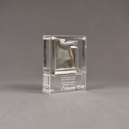 Angle view of small Allure™ Acrylic Encasement Award with helicopter rotor blade encased into clear acrylic showing laser engraving.