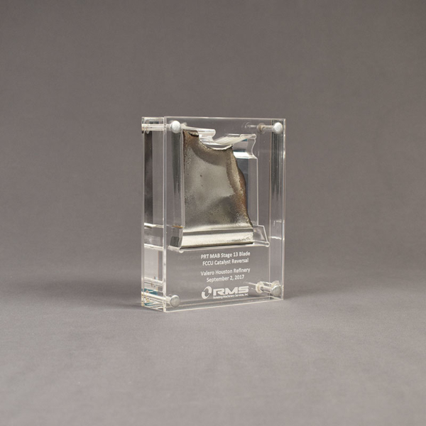 Angle view of small Allure™ Acrylic Encasement Award with helicopter rotor blade encased into clear acrylic showing laser engraving.