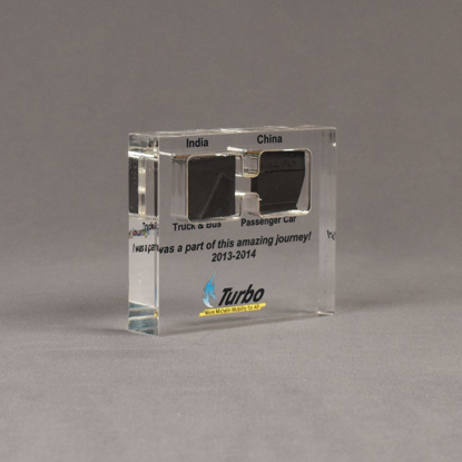 Angle view of medium Allure™ Floating Acrylic Encasement Award with passenger and truck tire sample encased into clear acrylic showing full color imprint.