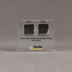 Front view of medium Allure™ Floating Acrylic Encasement Award with passenger and truck tire sample encased into clear acrylic showing full color imprint.