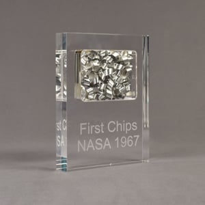 Angle view of large Allure™ Floating Acrylic Encasement Award with aluminum metal shavings encased into clear acrylic showing engraved text.