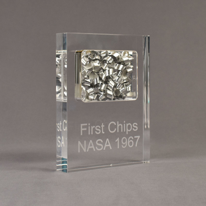 Angle view of large Allure™ Floating Acrylic Encasement Award with aluminum metal shavings encased into clear acrylic showing engraved text.