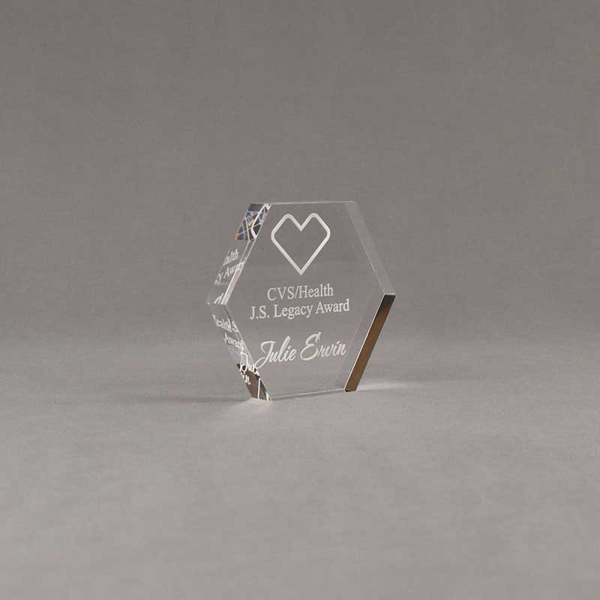 Angle view of 3" Aspect™ Hexagon™ Acrylic Award featuring CVS logo laser engraved with Legacy Award text.