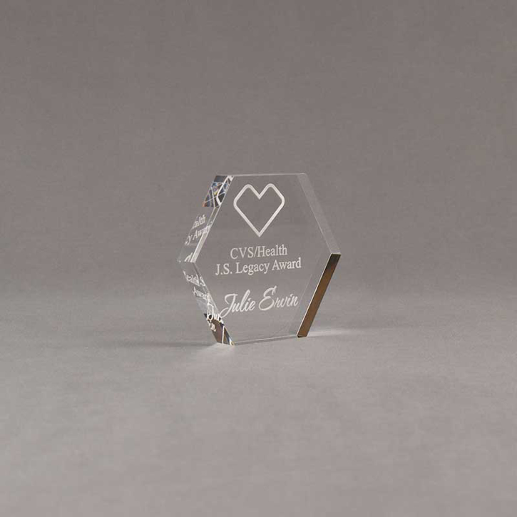 Angle view of 3" Aspect™ Hexagon™ Acrylic Award featuring CVS logo laser engraved with Legacy Award text.