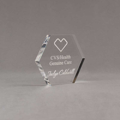 Angle view of 4" Aspect™ Hexagon™ Acrylic Award featuring CVS logo laser engraved with Genuine Care Award text.