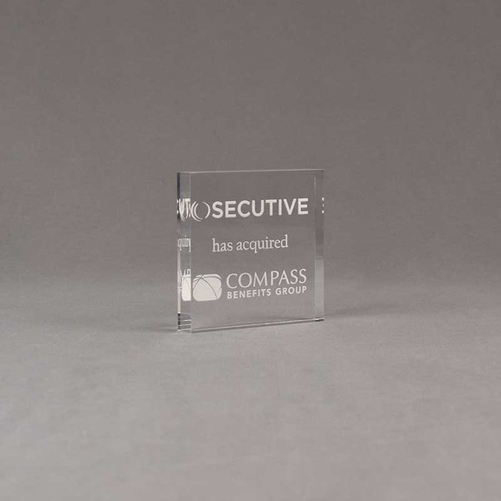 Angle view of Aspect™ 3" Square™ Acrylic Award featuring SECUTIVE logo laser engraved and Compass Benefits Group text.