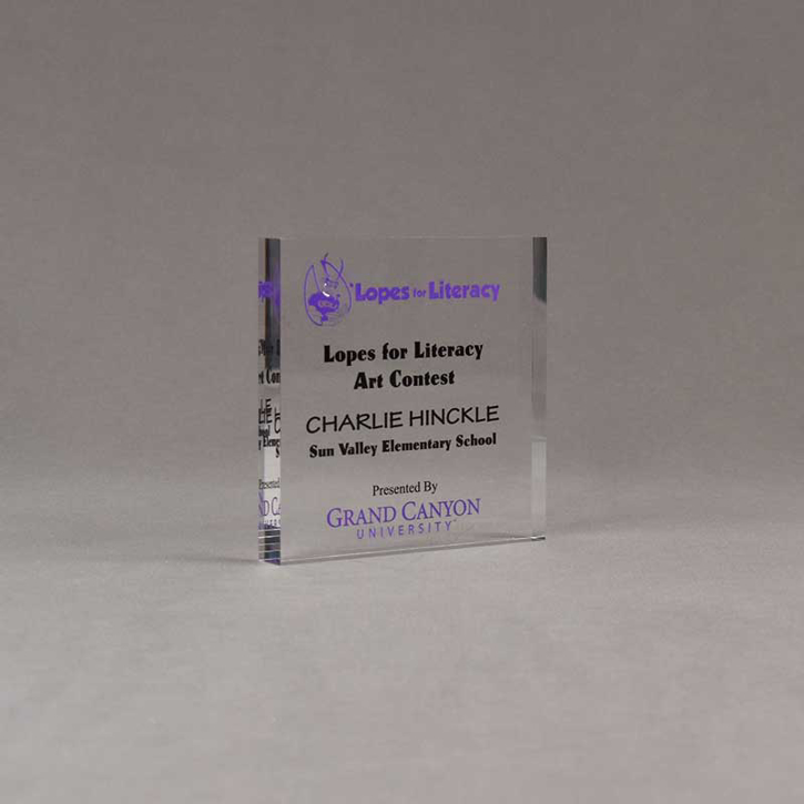 Angle view of Aspect™ 4" Square™ Acrylic Award featuring Grand Canyon College logo printed in full color and Lopes for Literacy text.