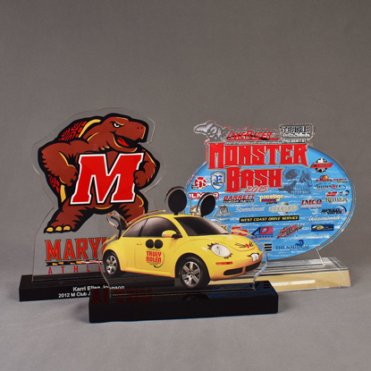 Three custom shaped Choice Series LaserCut™ Acrylic Awards showing a Maryland Athletics Turtle, a Truly Nolen VW Bug Car and Monster Bash Logo.