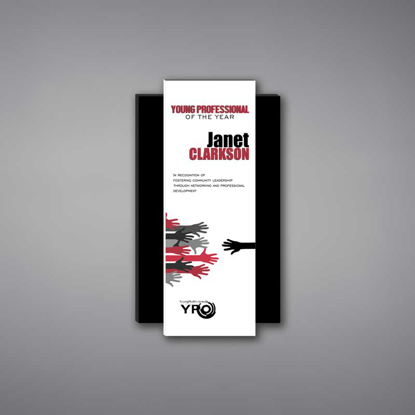 Shadow Acrylic Plaque shown 10" tall with a white acrylic face plate over a rectangle shaped black acrylic background with Young Professional logo and award text printed.