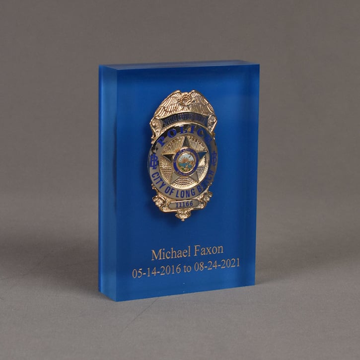 Angle view of 6" Lucite® Badge Embedment with police service badge cast inside clear acrylic.