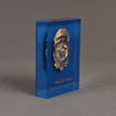 Side view of 6" Lucite® Badge Embedment with police service badge cast inside clear acrylic.