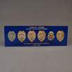 Front view of Lucite® Badge Embedment with six career service badges cast inside clear acrylic with laser engraved text.
