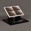 The angle view of the SolarCity Deal Toy features an acrylic fabricated solar array with full color printing displayed on a black acrylic base.