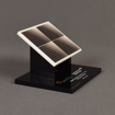 The side view of the SolarCity Deal Toy features an acrylic fabricated solar array with full color printing displayed on a black acrylic base.