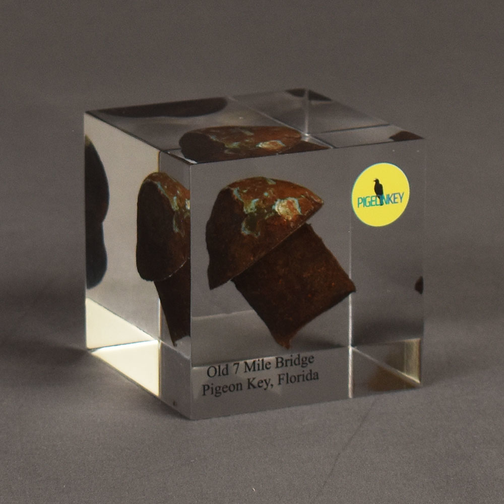 Angle view of the Old Seven Mile Bridge Deal Toy featuring an embedded rusted rivet from the original bridge prior to demolition.