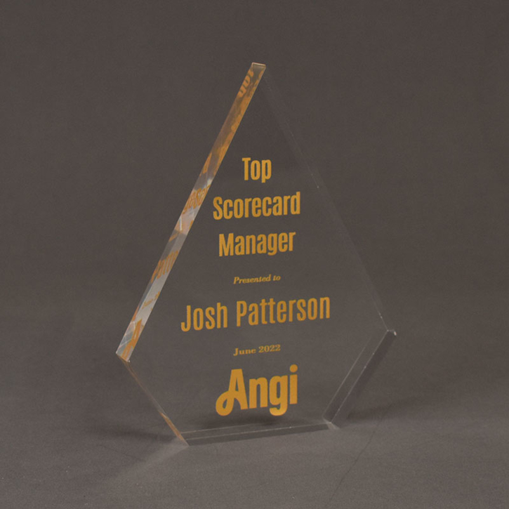 Angle view of the Angi, Inc. Top Scorecard Manager Award featuring our exclusive Aspect™ Peak shaped acrylic trophy with gold ultraviolet printing.